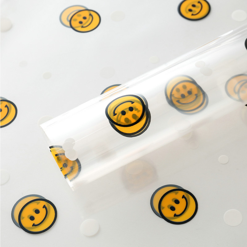 Carta da regalo con fiori con volto sorridente in cellophane OPP